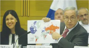  ?? (Marc Israel Sellem/The Jerusalem Post) ?? PRIME MINISTER Benjamin Netanyahu points to a colorcoded map yesterday during a session of the Knesset State Control Committee. The map indicates the status of Israel’s ties with various countries.