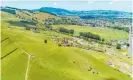  ??  ?? An aerial view over Paeroa, encompassi­ng the elevated 12.8ha block at 7 Colin Drive, left. The site for sale at 23 Bristol Place, Te Rapa, is indicated by a red border.