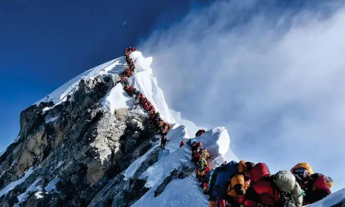  ??  ?? The scene at the summit of Mount Everest on Tuesday. Photograph: Nirmal Purja/AFP/Getty Images