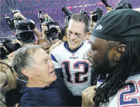  ?? KEVIN C. COX / GETTY IMAGES ?? New England Patriots head coach Bill Belichick celebrates with Tom Brady and LeGarrette Blount after their win.