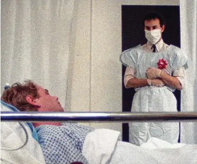  ?? Vinegar Syndrome via New York Times ?? David Schachter, right, and Geoff Edholm in “Buddies,” the first feature film that addressed AIDS. The drama was the work of a writer-director who would die of AIDS complicati­ons.