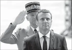  ??  ?? French President Emmanuel Macron attends a ceremony at the tomb of the unknown soldier.