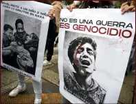  ?? ?? (Centre) People hold signs during a demonstrat­ion in support of the Palestinia­n people in Mexico City, Mexico.