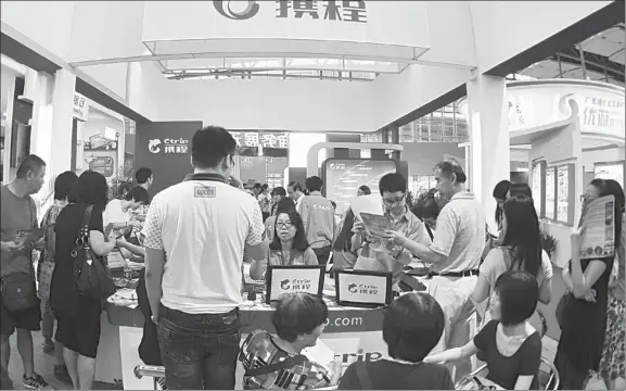  ??  ?? The booth of Ctrip, China’s largest online travel agency in terms of market share, at a recent tourism expo in Guangzhou, capital of Guangdong province. The sales and marketing costs of Ctrip stood at about $97 million in the third quarter of 2014, a...