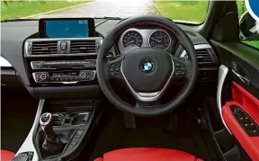  ??  ?? 2 Series has a sporty driving position and user-friendly infotainme­nt. Red leather was an option – darker colours are available