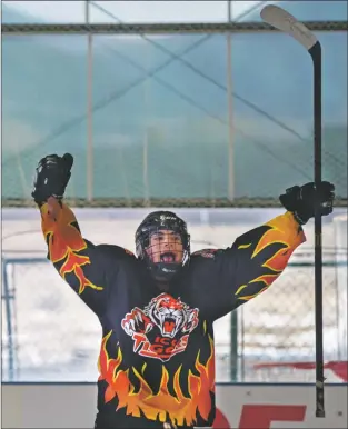  ?? Morgan Timms ?? Taos’ Ysidro Gravelle reacts after scoring a goal Sunday (Nov. 18) during Taos’ 6-7 loss to the Amarillo Bulls at the Taos Youth &amp; Family Center ice rink.