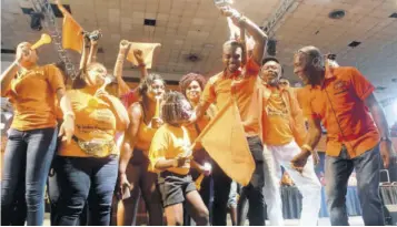  ?? (Photo: Karl Mclarty) ?? Comrades in a jovial display on stage at the People’s National Party’s Annual Conference on Sunday, September 18, 2022