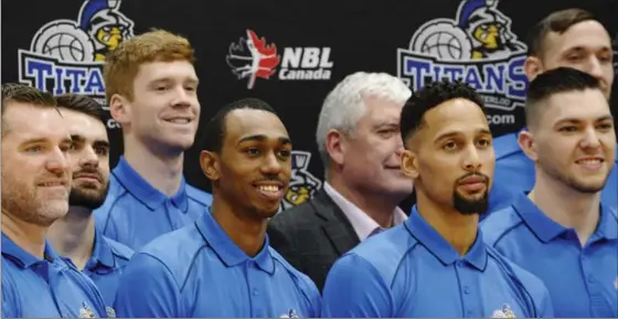  ?? IAN STEWART, SPECIAL TO THE RECORD ?? Devon Moore, centre left, joins the K-W Titans after playing in Germany last year. The Titans announced their schedule and roster on Wednesday at RIM Park in Waterloo.