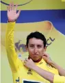  ?? AP Photo/Christophe Ena ?? ■ New overall leader Colombia’s Egan Arley Bernal Gomez celebrates Friday after the 19th stage of the Tour de France cycling race.