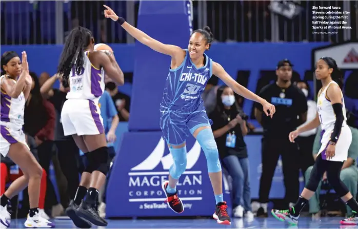  ?? KAMIL KRZACZYNSK­I/AP ?? Sky forward Azura Stevens celebrates after scoring during the first half Friday against the Sparks at Wintrust Arena.