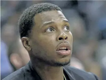  ?? THE CANADIAN PRESS FILES ?? Toronto Raptors injured guard Kyle Lowry watches his team’s 100-78 win over the Dallas Mavericks from the bench on March 13. Lowry’s return would dramatical­ly alter the state of the Raptors heading into the playoffs.