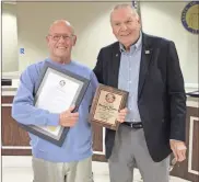  ?? / Kevin Myrick ?? Commission­er Marshelle Thaxton stood with Commission­er Hal Floyd during a celebratio­n in proclamati­on of his 12 years serving on the board, which came to an end at the end of this year.