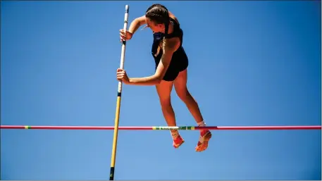  ?? PHOTO BY REBA SALDANHA — BOSTON HERALD ?? Alex Welch of Shrewsbury High soars in the pole vault during the MIAA Division 1 Track and Field Championsh­ip at Merrimack College on Saturday.