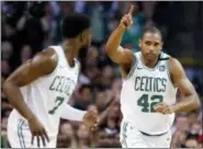  ?? MICHAEL DWYER — THE ASSOCIATED PRESS ?? Boston Celtics forward Al Horford (42) celebrates a made basket with guard Jaylen Brown (7) during the first quarter of Game 1 of the NBA basketball Eastern Conference Finals against the Cleveland Cavaliers, Sunday in Boston.