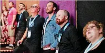  ??  ?? One of the 2018 deadCenter Film Festival’s Oklahoma Film Icon winners, Ryan Merriman, center, watches a highlight reel June 8 before the screening of “The Jurassic Games” at Harkins in Bricktown. With him are, left, deadCenter Executive Director Lance...