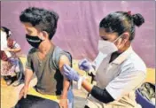  ?? RISHIKESH CHOUDHARY/HT ?? A medic vaccinates a beneficiar­y at a special vaccinatio­n drive for the specially abled in Mumbai on Tuesday.