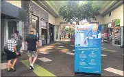  ??  ?? Some visitors to the Chico Mall on Sunday had to wear masks to enter stores or wait in lines to allow for capacity for social distancing. Some recreation­al areas were also taped off.