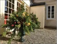  ??  ?? Left: Outdoor Christmas urns also look great from the inside.