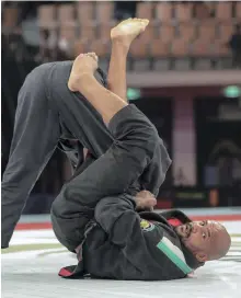  ??  ?? Igor Silva, bottom, earned 200 world-ranking points with his win at the Grand Slam Abu Dhabi Victor Besa / The National