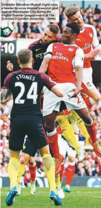  ?? – AFPPIX ?? Defender Shkodran Mustafi (right) wins a header to score Arsenal’s second goal against Manchester City during the English Premier League match at The Emirates in London yesterday.