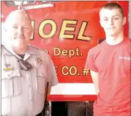  ?? RACHEL DICKERSON MCDONALD COUNTY PRESS ?? Blake Barrett, right, who just received his EMT certificat­ion and joined the Noel Fire Department, is pictured with his father, Noel Fire Chief Brandon Barrett.