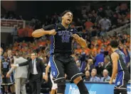  ?? Daniel Sangjib Min / Associated Press ?? Duke’s Jahlil Okafor has something to shout about late in the second half against Virginia.