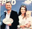  ??  ?? Carl Hinchy pictured with wife Louisa and son Monty