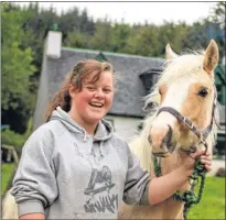  ??  ?? HORSE LOVER: Sarah Pocock with one fo the croft’s 19 horses.