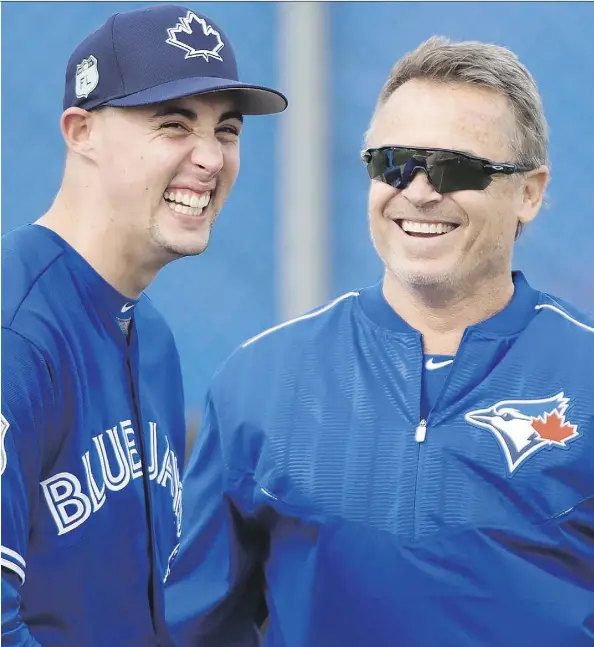  ?? NATHAN DENETTE/THE CANADIAN PRESS ?? Toronto Blue Jays manager John Gibbons, seen sharing a laugh with starting pitcher Aaron Sanchez at spring training in Dunedin, Fla., on Wednesday, says he has “no concerns” about Sanchez’s ability to start for a full season after last year’s campaign.