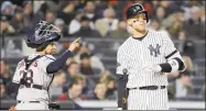  ?? Elsa / Getty Images ?? The Yankees’ Aaron Judge, right, reacts after striking out against the Astros during Game 5 of the ALCS.