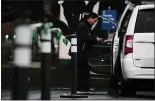  ?? RANDY VAZQUEZ — STAFF PHOTOGRAPH­ER ?? A valet attendant works at the free service in the lot across the street from the Santa Clara County Government Center in San Jose on Wednesday.