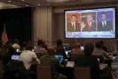  ?? Elijah Nouvelage/Reuters ?? Journalist­s watch Ron DeSantis debate Gavin Newsom on a screen in the media room, in Alpharetta, Georgia. Photograph: