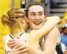  ?? THE MORNING CALL FILE PHOTO ?? Allentown Central Catholic’s Jackie Adamshick, right, hugs teammate Emily Guman after a Vikettes victory in 2001.