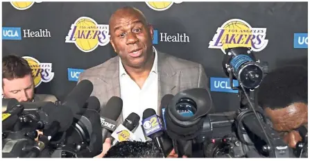  ?? — AFP ?? Clearing the air: Magic Johnson reacts as he speaks to the press on his resignatio­n as Los Angeles Lakers president of basketball operations before the game against the Portland Trail Blazers at Staples Centre on Tuesday in Los Angeles, California.