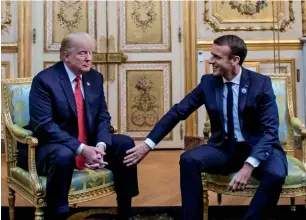  ?? AFP ?? uS President Donald Trump speaks with french president emmanuel macron prior to their meeting at the elysee Palace in Paris on Saturday. —