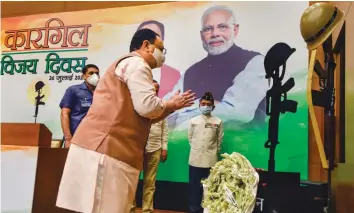  ?? — PTI ?? BJP president J.P. Nadda pays tribute to martyrs during an event on the occasion of Kargil Vijay Diwas at BJP HQ in New Delhi on Sunday.