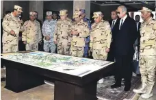  ?? AP ?? Egyptian President Abdel Fattah El Sisi, centre, met the new East Suez Canal Counter-Terrorism command in Sinai last week