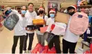  ?? ?? Neil Llamanzare­s plays Santa for a day as he treats kids to shop for new shoes, shirts and bags.