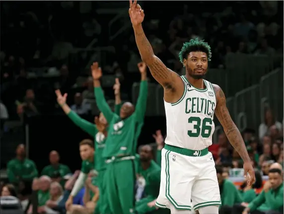  ?? MATT STONE — BOSTON HERALD ?? Marcus Smart of the Boston Celtics celebrates during the second half of a game against the Pistons at the TD Garden on November 9, 2022 in Boston .