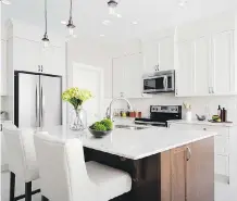  ?? COURTESY SHANE HOMES ?? The L-shaped kitchen in the Tofino II by Shane Homes in Midtown.