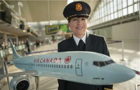  ?? RICK MADONIK/TORONTO STAR ?? Captain Judy Cameron readies herself for the last flight of her career, from Munich to Toronto. In 37 years, she has logged 23,000 hours of flight time.