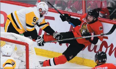  ?? CP PHOTO / SEAN KIPATRICK ?? Pittsburgh Penguins defenceman Brian Dumoulin (8) checks Ottawa Senators right wing Bobby Ryan (9) during the third period of game four of the Eastern Conference final in the NHL Stanley Cup hockey playoffs in Ottawa on Friday.