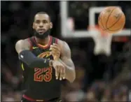  ?? TONY DEJAK — THE ASSOCIATED PRESS ?? Cleveland Cavaliers’ LeBron James passes in the first half of an NBA basketball game against the Golden State Warriors, Monday in Cleveland.