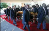  ?? PAUL SANCYA — THE ASSOCIATED PRESS ?? Pallbearer­s carry the gold casket of legendary singer Aretha Franklin after arriving at the Greater Grace Temple in Detroit, Friday. Franklin died Aug. 16 of pancreatic cancer at the age of 76.