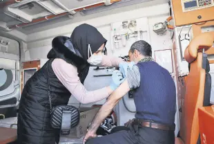  ?? ?? A man gets vaccinated against COVID-19, in Şanlıurfa, southeaste­rn Turkey, Feb. 16, 2022.