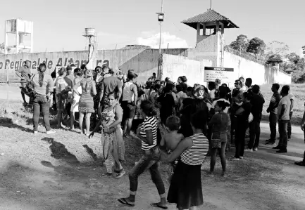  ?? AP ?? People seek informatio­n about family members who are prisoners after a riot inside the Regional Recovery Center in Altamira, Brazil, on Monday. At least 57 prisoners were killed by other inmates during clashes between organised crime groups in the Altamira prison in northern Brazil on Monday, with 16 of the victims being decapitate­d, according to prison officials.