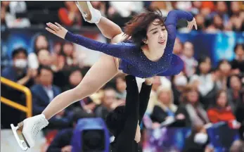  ?? ISSEI KATO / REUTERS ?? China’s Sui Wenjing and Han Cong in action during Thursday’s pairs free skate at the ISU world championsh­ips in Saitama, Japan.