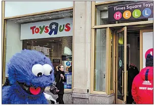  ?? Bloomberg file photo ?? Toys R Us stores, like this one at Times Square in New York City, were long the unrivaled supermarke­t of toys, but the acquisitio­n of the retailer by an investor group in 2005 failed to lead to its turnaround and left it drowning in debt.