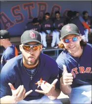  ?? Karen Warren / Houston Chronicle ?? George Springer, left, pictured here with teammate Josh Reddick, helps form the nucleus of the defending World Series champion Houston Astros.