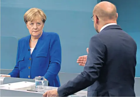  ??  ?? Mrs Merkel came under attack from Martin Schulz, who did not land a winning blow